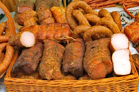 Traditional meet on a stall in a market の写真素材