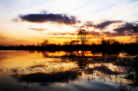 Beautiful sunset reflecting in a lake in Siedlce, Polandの写真素材