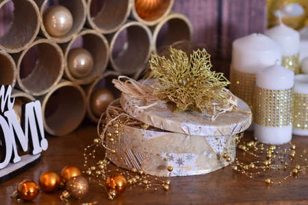 Christmas gift with big white candles and Christmas tree toysの写真素材