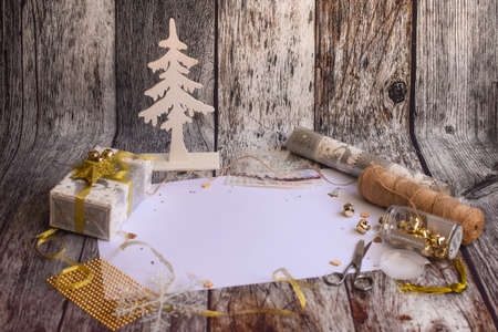 Preparing for Christmas. White blank sheet in the center for the inscription. Everything for making Christmas props.の写真素材