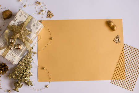 Place for an inscription. New Years composition. golden decorations, gift, tree.の写真素材