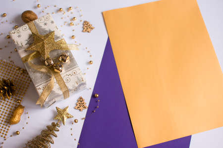 Merry Christmas and Merry Christmas and Happy Holidays greeting cards, banner. New Year. Blank sheets of paper. Christmas handmade gift box isolated on white background from above.の写真素材