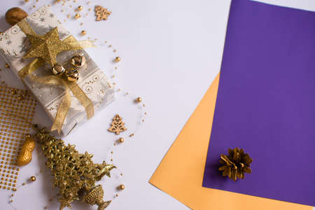 Christmas and New Year background for card. Gift and decor on a white background. Blank sheets of paper.の写真素材
