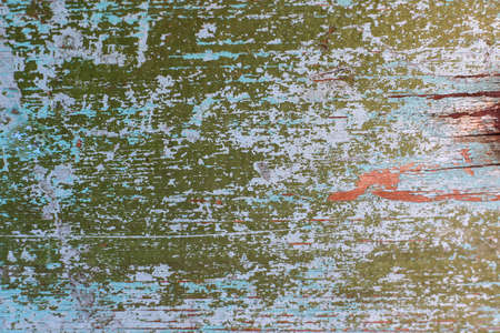 Texture in green. Matte surface. There is a patch on the texture, old texture with damaged paint. Texture with smudges of paint, cracked material from time and old age.の写真素材