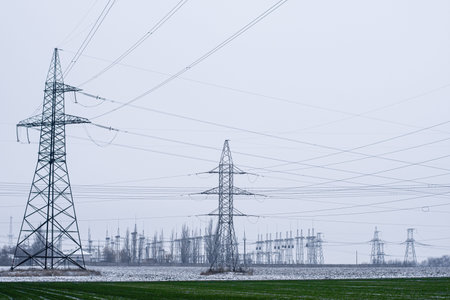 transmission of large amounts of electricity. towers of high-voltage wires.