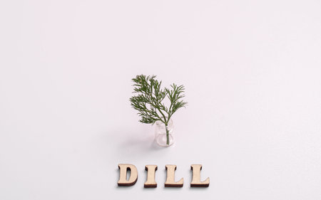 Fresh dill in a small bottle. With an inscription