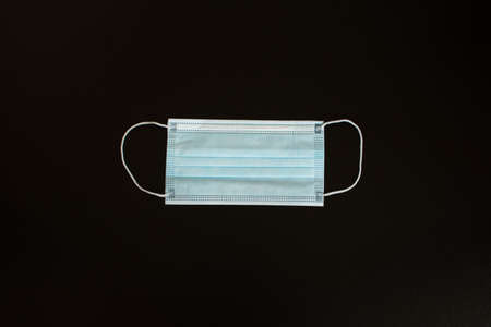 Medical mask on a black background. Close-up.の写真素材