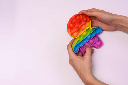 fingers press the sensor to pop it. mock upの写真素材