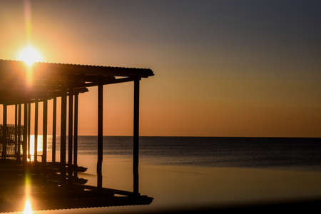 morning at the resort by the sea. sunrise on the seashore.の写真素材