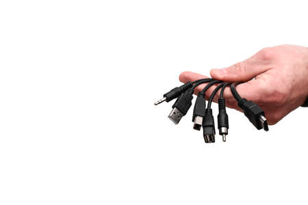 a bunch of different wires of computer connectors in the hand. mock upの写真素材