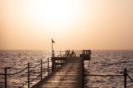 pier at dawn. against the background of the red seaの写真素材