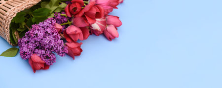 flowers of tulips and lilacs in a basket on a blue background. mock up