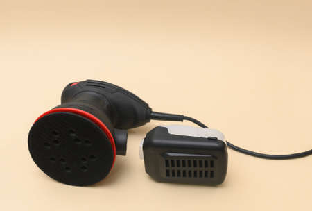 eccentric orbital grinder and a chip collection container.の写真素材