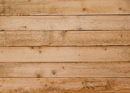 The background or texture of a wooden wall. Natural wood backdrop with a patternの写真素材