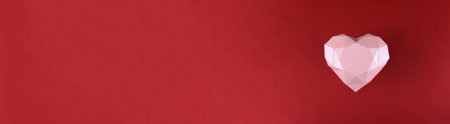 heart banner on a red background. Polygonal pink heart made of paper. copy spaceの写真素材