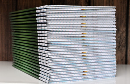 albums are stacked on the table