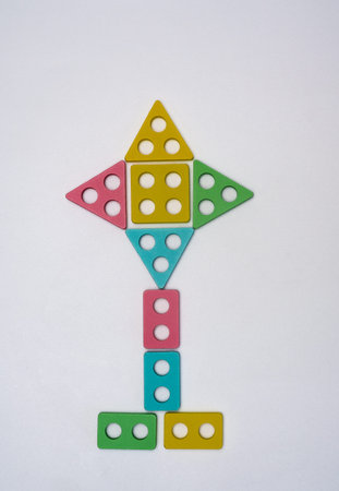 The flower figurine is lined with geometric shapes on a white background. concept