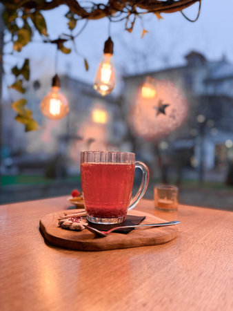 tea glass on a wooden table. one cup with a drink