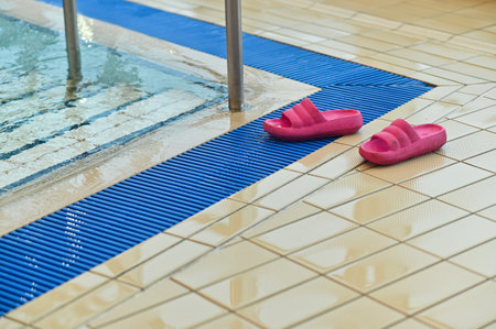 flip-flops left in front of the poolの写真素材