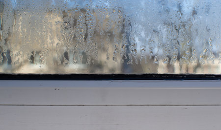 drops of water run down the glassの写真素材