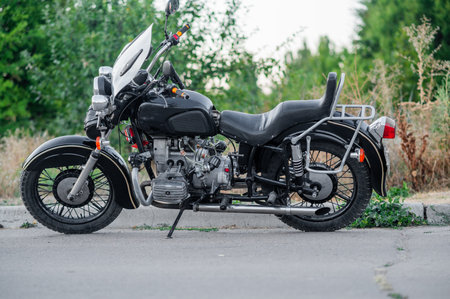 the motorbike is on a stand. black retro motorcycleの写真素材