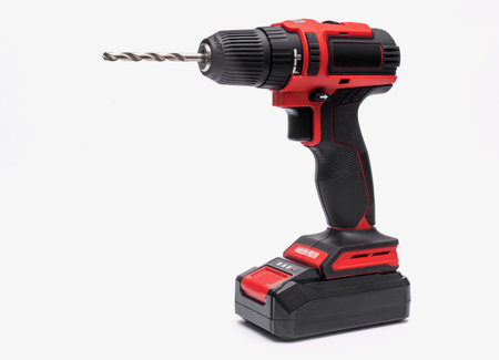 an electric cordless screwdriver with a drill bit. isolated on a white background.