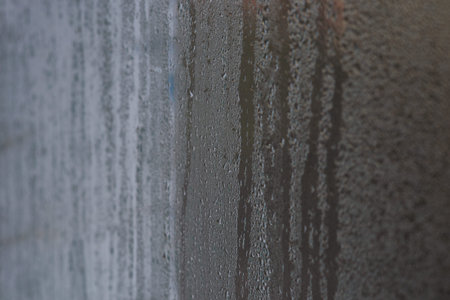 Slow-growing condensation droplets pattern interior glass like morning dew. abstract with glass background. fogged window inside apartment, increased humidity and cold form condensation on windowの写真素材