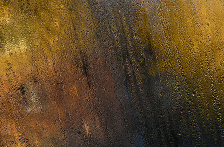 Wet glass window with water droplets, blurring view. Condensation creates natural abstract patterns....