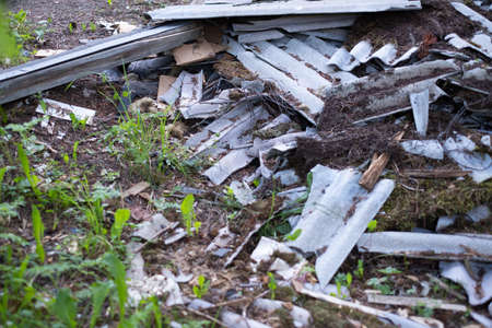 Deserted old broken construction materials laying on the groundの写真素材