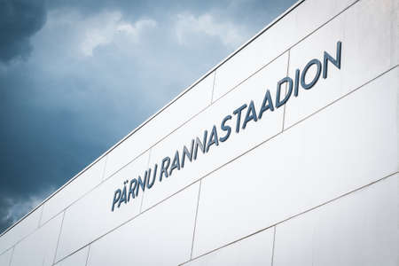 PÃ¤rnu, Estonia - June 5, 2021: PÃ¤rnu Rannastaadion (PÃ¤rnu Beach Stadium) sign on the outside wall of the sports field. PÃ¤rnu municipal sports facility used for football and track and field.のeditorial素材