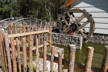 Beautiful little water mill in a small village creating  green energy and power.