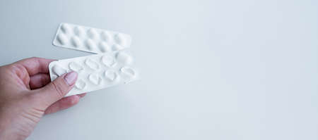 Package of white pills. Pharmacy and medicine concept. Empty copy space.の写真素材