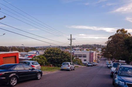 Suburban Australia street with industrial buildings, vehicles and trees. Suburb of Brookvale in the Northern Beaches area of Sydney, New South Wales, Australia.のeditorial素材