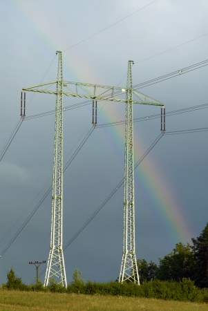 meadow and the beautiful rainbow during summer stormsの写真素材