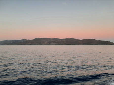 Morning sunrise on the horizon of the Aegean sea.の写真素材