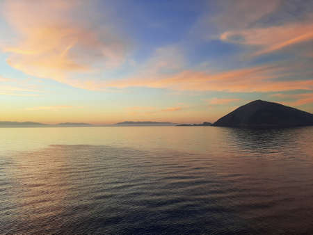 Morning sunrise on the horizon of the Aegean sea.の写真素材
