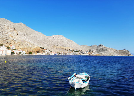 Small boat in the harbor of Symi island, Greece.の写真素材