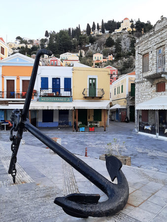 Big anchor in the center of Symi island in Greece.