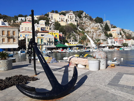 Big anchor in the center of Symi island in Greece.