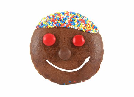 Cute and colorful chocolate gingerbread face smiling.の写真素材