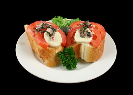Fresh and light roma tomato and bocconcini bites topped red onion and basil oil.の写真素材