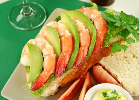 Delightful fresh shrimp and avocado open sandwich with lemon mayonnaise.の写真素材
