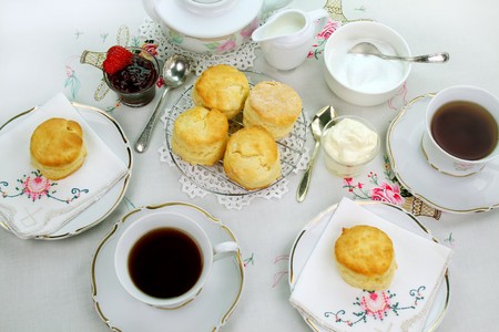 Devonshire tea and fresh baked scones with jam and cream.の写真素材