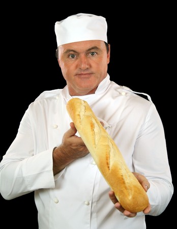 Chef holds and presents french stick to camera.の写真素材
