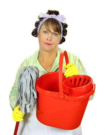 Frumpy unhappy middle aged housewife with a mop and bucket.の写真素材