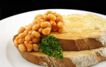 Baked beans on sourdough toast for a delicious breakfastの写真素材