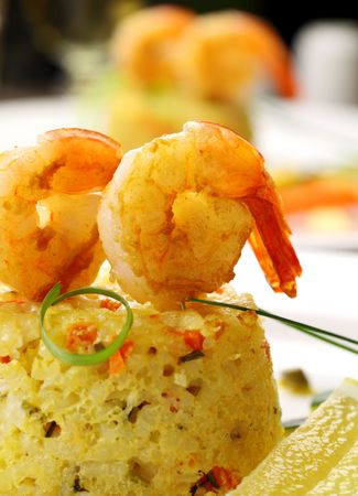 Delicious grilled shrimps on a risotto stack with side salad.の写真素材