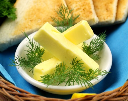 Tray of butter sticks with Italian parsley ready to serve.の写真素材