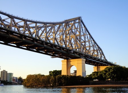 Story Bridge and the Brisbane skyline seen from the river about to pass under the bridge.の写真素材