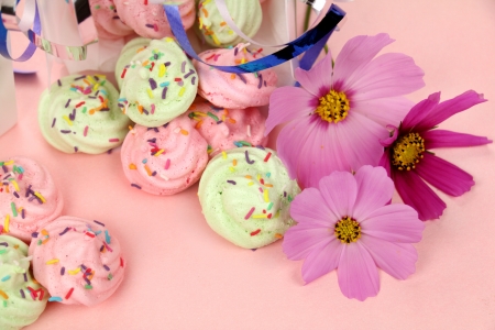 Christmas gift boxes with delightful colored meringues with cosmos flowers.の写真素材